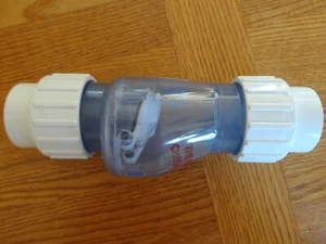 The Quiet Check Valve 1-1/2" PVC Clear with 1/2 lb Spring Union x Union 1.5" - Picture 1 of 5