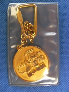 Bulldozer-Llavero Llavero Vintage (Fábrica Radoje Dakic Titograd Ex Yugoslavia - Imagen 1 de 12