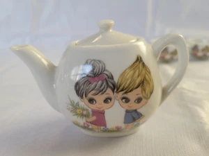 14 PIECE Vintage Japan Porcelain Child’s Tea Set Boy Girl Pick Flowers Black Bun - Picture 1 of 9