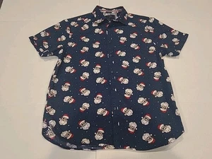 Camicia natalizia con bottoni Babbo Natale in denim e fiori. MEDIA - Foto 1 di 5