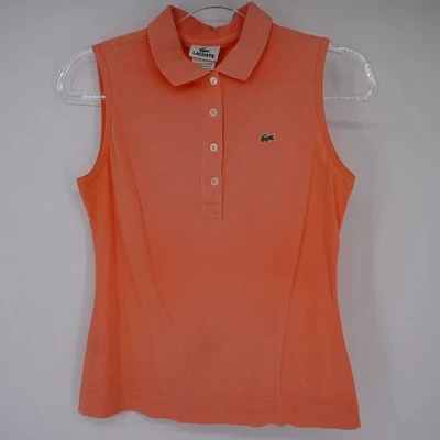 Camisa polo de tenis de piqué de algodón sin mangas coral Lacoste para mujer talla 38 Foto 1 de 4