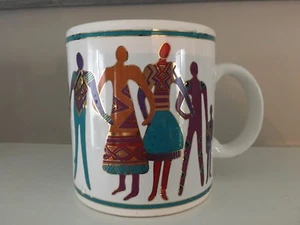 Taza de café de cerámica Laurel Burch El arte del ser humano 1992 excelente - Imagen 1 de 4