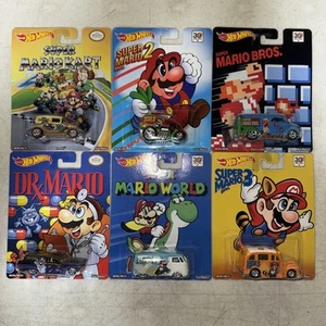 Hot Wheels 2015 Nintendo Mario Bros 1, 2, 3 Mario Kart Mario World DR Mario - NEU - Bild 1 von 13