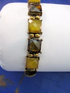 BRACCIALE DONNA SU CORDONCINO ELASTICO - PIETRE VETRO AMBRATO E GIALLO - Foto 1 di 5