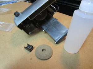 NEW HOBARTSLICER MODELS 1612E,1712E SHARPENER ASSY STONES AND OIL OEM#00-274926 - Picture 1 of 2