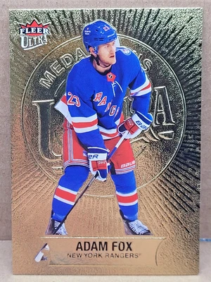 2021-22 Upper Deck Fleer Ultra Adam Fox Medallions Gold #M-38 - Image 1 of 2