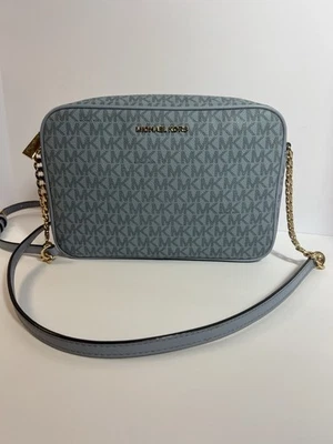 Michael Kors East West Jet Set Signature Pale Blue Faux Leather Cross Body Bag - Image 1 of 4