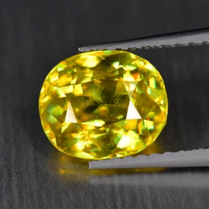 1.97Ct Oval_Sparkling Lustrous Unheated Multi Color Titanite Sphene - Picture 1 of 1