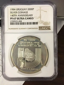 1984 URUGUAY SILVER 2000 N$ 140th ANN SILVER COINS, BANK GOVERNORS NGC PF 67 UC - Picture 1 of 4