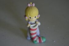 PRECIOUS MOMENTS GIRL HOLDING RED/WHITE STOCKING FIG  #169951
