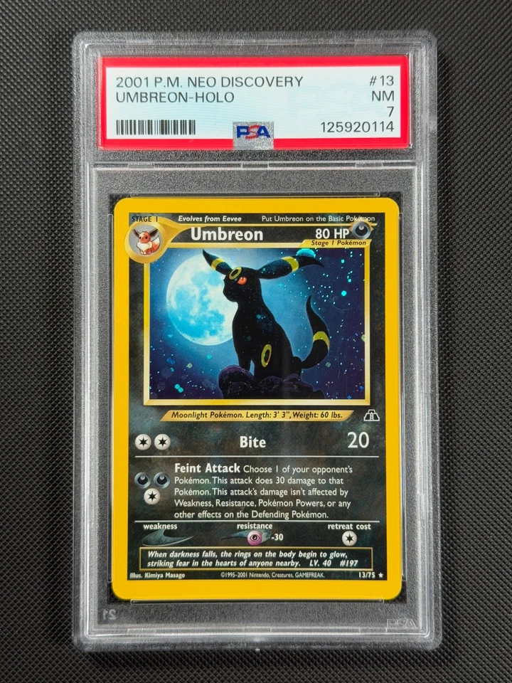 PSA 7 Umbreon 13/75 HOLO Pokémon Card WOTC Neo Discovery Rare Holo NM - Image 1 of 4