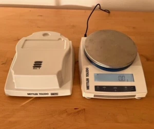Mettler Toledo Präzisionswaagen PL6001E 6200g x 0,1g Batterieoption + Deckeldeckel - Bild 1 von 16