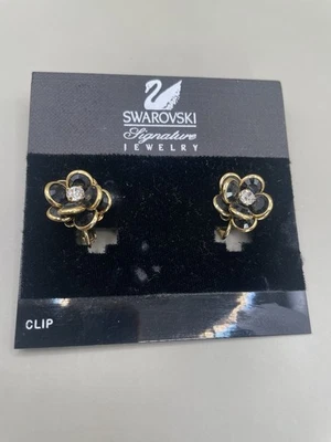 Vintage Swarovski Flower Shaped Black GoldTone Clip On 0.7” Earrings New on Card - Image 1 of 4