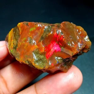 Ópalo de fuego Welo etíope natural de 149 quilates áspero - destello rojo y verde | 49x29x23 mm - Imagen 1 de 8