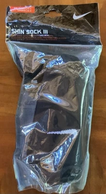 NIKE YOUTH UNISEX SHIN SOCK SLEEVE MEDIUM/LARGE, BLACK *DISTRESSED PKG - Image 1 of 4
