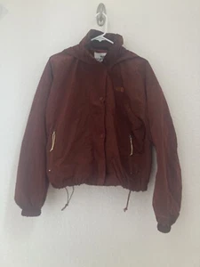 Chaqueta cortavientos utilitaria para mujer The North Face mediana M66 marrón brandy capucha embalable - Imagen 1 de 10