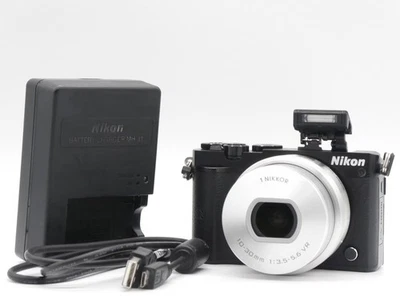 Englisch OK NEUWERTIG Nikon 1 J5 20,8 MP Digitalkamera schwarz VR PD... - Bild 1 von 4