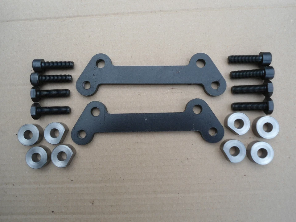 2 OLLAS PINZA FRENO TRASERO SOPORTE DE CONVERSIÓN CLÁSICO AJUSTE SUBARU IMPREZA 1993-2000 Foto 1 de 1