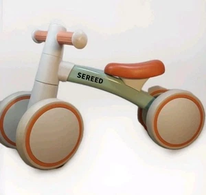 Bicicleta de equilibrio para niño pequeño de 12-24 meses verde y naranja quemado - Imagen 1 de 13