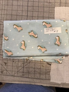 Light Blue Nursery Flannel Remnant with giraffes on it. Measures 20” X 42“. - Picture 1 of 1