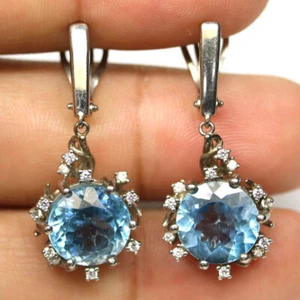 925 Sterling Silver 11 mm. Sky Blue Topaz & White Zircon Earrings - Picture 1 of 4
