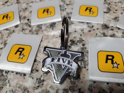 CANTIDAD 1-Grand Theft Auto V Logo Metal Rockstar Games AUTÉNTICO Llavero NUEVO Foto 1 de 4