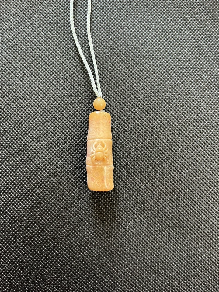 natural coral jade yellow and pink beetle on bamboo necklace - Image 1 of 4