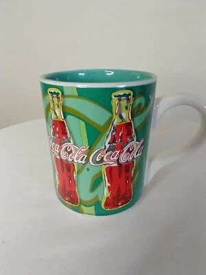 Taza de café Coca Cola 2002 Gibson verde/dorado/rojo... apta para plato/microondas Foto 1 de 4