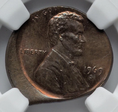 1969-S 1C CENT STRUCK 15% OFF CENTER ON 10% STRAIGHT CLIP PLANCHET NGC MS65 BN Cover