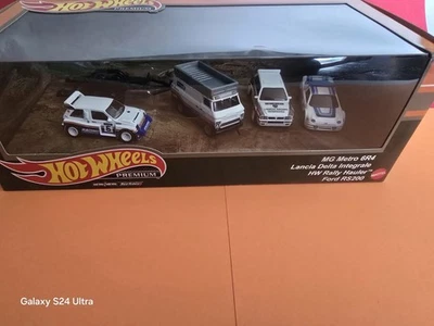 Camión de transporte de rally Hot Wheels Premium MG Metro 6R4 Lancia Delta Integrale Ford RS200 Foto 1 de 4