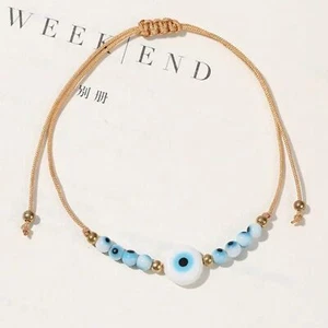 Pulsera de cuerda ajustable minimalista con cuentas mal de ojo blanco y azul unisex - Imagen 1 de 3
