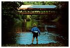 postcard Boy skips stones under Clear Fork Creek Mohican State Park Ohio A0526