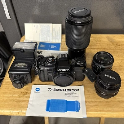 Minolta X-570 35mm film SLR camera with Three Lenses and Flash  - Image 1 of 4