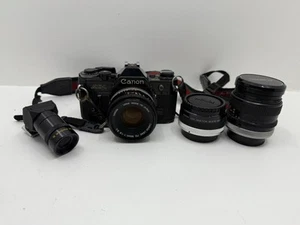 Canon AE-1 cuerpo negro con cámara fotográfica SLR de 35-70 mm f/4, 3 lentes, parte posterior de datos - Imagen 1 de 8