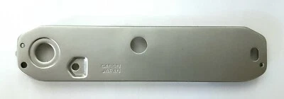 Крышка опорной пластины Canon снизу (серебристая) (включает винты) для AE-1 - Изображение 1 из 2