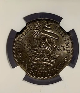 1943 BRITAIN 1 SHILLING ENGLISH CREST NGC AU58 - Picture 1 of 3