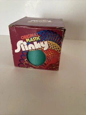 Juguete de resorte clásico de plástico original Slinky verde vintage Foto 1 de 4