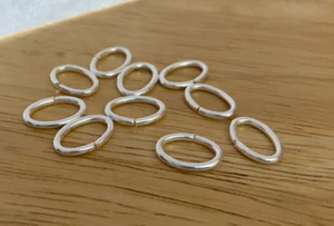 10 anillos de salto ovalados de plata base de metal calibre 17 8x13 mm adjuntar dijes pulsera - Imagen 1 de 3