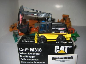 CATERPILLAR M 318 BAGGER TIEFLÖFFEL RACING #405.3 NZG 1:50 OVP - Picture 1 of 2