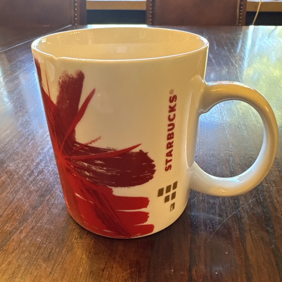 Starbucks Mug White Porcelain Red Starburst Art Dated2014 Collectible Small Chip - Image 1 of 4