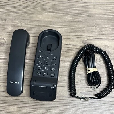 Teléfono con cable Sony IT-B3 de colección dial con botón negro y cable en espiral negro Foto 1 de 4