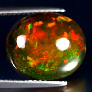 5.74 ct Eye-catching Oval Cabochon (14 x 12 mm) Ethiopian Flashing Black Opal - Picture 1 of 2
