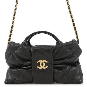 CHANEL Mini borsa con fiocco pelle di agnello lucida nera AS5849 - Foto 1 di 13