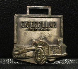 Reloj Rascador Tractor Caterpillar CAT DW21 Llavero MÁQUINA MISSOURI VALLEY Publicidad - Imagen 1 de 3