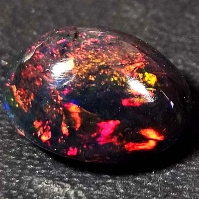 NATURAL AAA+ STUNNING COLORPLAY OVAL CABOCHAN  ETHIOPIAN WELO BLACK OPAL 1.50CTS - Image 1 of 3