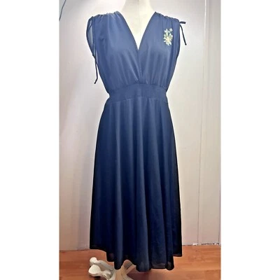 Vestido midi vintage Jonathan Logan negro cintura ajustada floral talla pequeña transparente Foto 1 de 4