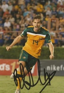 AUSTRALIA, BRISBANE ROAR & ASTON VILLA: BRETT HOLMAN SIGNED 6x4 ACTION PHOTO+COA - Picture 1 of 1