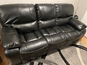 Black Bob's Furniture electric sofa with two USB outlets 