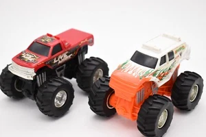Mattel Monster Jam Truck Lot of 2 Push N Go 1/43 Scale Live Wire & Eradicator - Picture 1 of 6