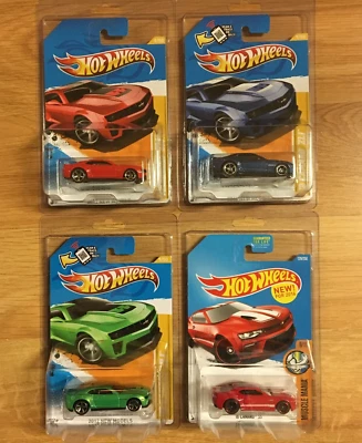 Lot Of 4 Hot Wheels 2012 New Models & Muscle Mania Chevy Camaro In Protect Packs - Image 1 of 4